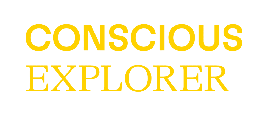 Yellow text on a light gray background reads "CONSCIOUS EXPLORER," with "CONSCIOUS" in bold uppercase and "EXPLORER" in a lighter uppercase font, inspired by Siham Lahmine, founder of Morocco Travel Organizer.
